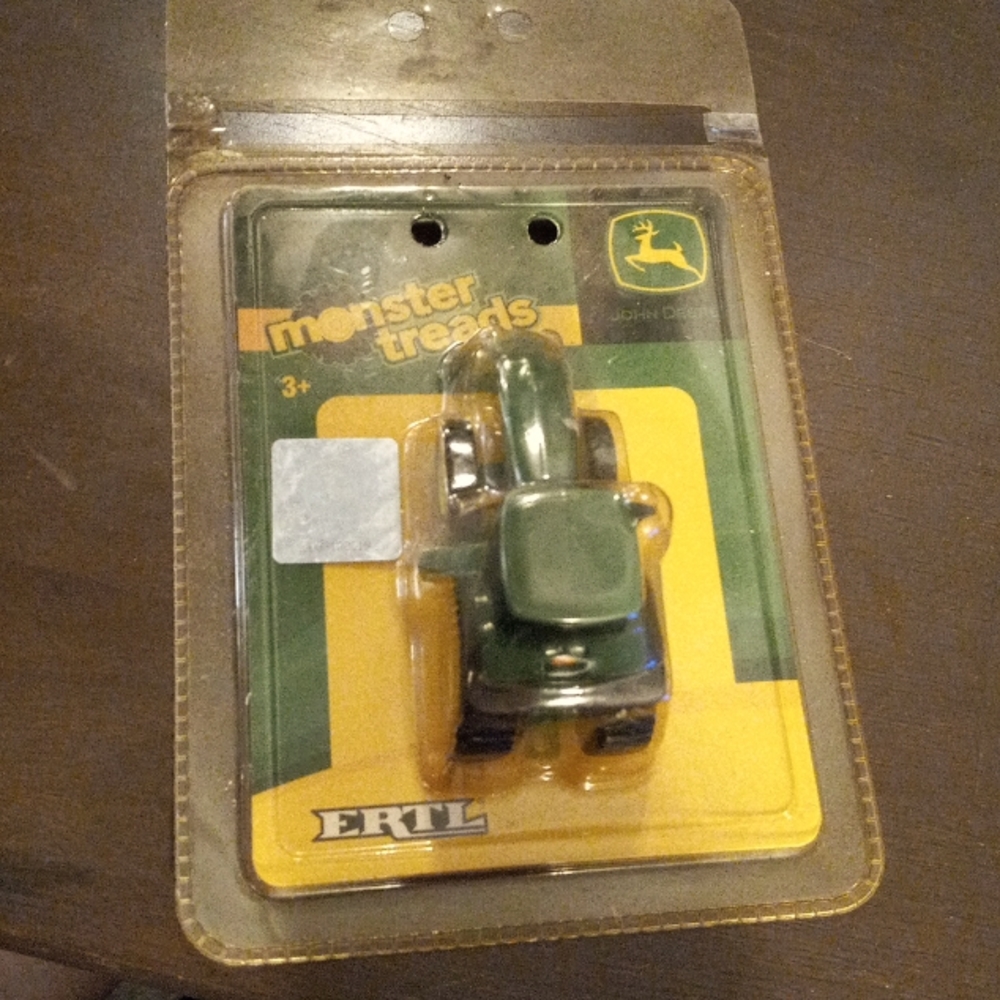 John Deere Monster Treads Tractor by Ertl. NIB hologram sticker